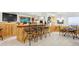 Entertaining basement bar with seating, wood paneling and adjacent sitting area at 1294 Kittery St, Castle Rock, CO 80104