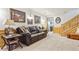 Comfortable basement living room, featuring a leather couch and decorated walls at 1294 Kittery St, Castle Rock, CO 80104