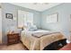 Calm bedroom with natural light, featuring a comfortable bed and classic furnishings at 1294 Kittery St, Castle Rock, CO 80104