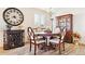 Elegant dining room featuring a wooden table, china cabinet, and decor at 1294 Kittery St, Castle Rock, CO 80104