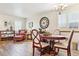 Dining room with a wooden table, chairs, and adjacent living area at 1294 Kittery St, Castle Rock, CO 80104