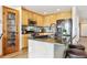 Modern kitchen features granite countertops, stainless appliances, bar seating, and ample cabinet space at 1294 Kittery St, Castle Rock, CO 80104
