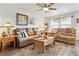Comfortable living room featuring sofas, a ceiling fan, and natural light at 1294 Kittery St, Castle Rock, CO 80104