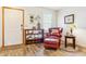 Inviting living room featuring a reading nook, wood floors, and natural light at 1294 Kittery St, Castle Rock, CO 80104