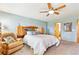 Comfortable primary bedroom with ceiling fan, and ample furniture space at 1294 Kittery St, Castle Rock, CO 80104