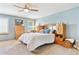 Serene primary bedroom with large window, ceiling fan, and light blue walls at 1294 Kittery St, Castle Rock, CO 80104