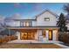Features a covered patio, built-in grill, and large sliding glass doors offering views to a beautifully designed interior at 1620 S Ogden St, Denver, CO 80210