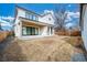 Spacious backyard featuring a modern patio, sliding glass doors, and a built-in grill, perfect for outdoor entertaining at 1620 S Ogden St, Denver, CO 80210