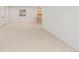 Spacious basement with neutral carpet and bright white walls, ready for customization at 1620 S Ogden St, Denver, CO 80210