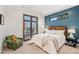 Stylish bedroom with modern design elements and ample natural light at 1620 S Ogden St, Denver, CO 80210