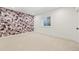 Spacious bedroom with decorative wallpaper and natural light at 1620 S Ogden St, Denver, CO 80210