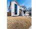 Beautiful two-story home with a white brick facade and lush, green front yard at 1620 S Ogden St, Denver, CO 80210