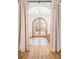 Elegant foyer with hardwood floors, arched doorway, and soft, neutral decor at 1620 S Ogden St, Denver, CO 80210