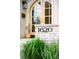 Elegant house number '1620' displayed near the front door, complemented by lush greenery at 1620 S Ogden St, Denver, CO 80210