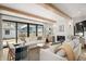 Spacious living room featuring natural light, comfortable seating, and a cozy fireplace at 1620 S Ogden St, Denver, CO 80210
