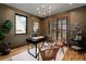 Stylish home office with hardwood floors, a large window, and ample workspace at 1620 S Ogden St, Denver, CO 80210