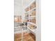 Well-organized walk-in pantry with custom shelving and ample storage space at 1620 S Ogden St, Denver, CO 80210