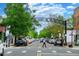 Street view featuring the 'South Pearl Street' sign, lined with trees and parked cars at 1620 S Ogden St, Denver, CO 80210