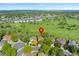 A high angle view of the property in a neighborhood with a golf course in the background at 8040 W 78Th Cir, Arvada, CO 80005
