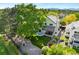 Aerial view of a home with a well-manicured lawn, patio, and beautiful landscaping at 8040 W 78Th Cir, Arvada, CO 80005