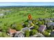 A high angle view of the home in a neighborhood with a golf course and lake in the background at 8040 W 78Th Cir, Arvada, CO 80005