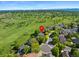 Beautiful aerial shot of a neighborhood with mature trees and a golf course surrounding the properties at 8040 W 78Th Cir, Arvada, CO 80005