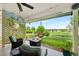 Inviting covered patio with seating, fire pit and serene views of the backyard and community at 8040 W 78Th Cir, Arvada, CO 80005