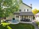 Beautiful backyard with a large tree, lush grass, and a patio area for relaxation and entertainment at 8040 W 78Th Cir, Arvada, CO 80005