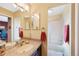 Bright and clean bathroom featuring dual sinks, ample counter space, and a tub-shower combo at 8040 W 78Th Cir, Arvada, CO 80005