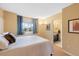 Comfortable bedroom featuring a full-sized bed, large window, and neutral toned walls at 8040 W 78Th Cir, Arvada, CO 80005