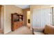 Bright hallway with built-in bookshelf storage, ample closet space, and neutral colored walls at 8040 W 78Th Cir, Arvada, CO 80005