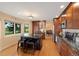 Modern kitchen featuring stainless steel appliances, granite countertops, and a central island with bar seating at 8040 W 78Th Cir, Arvada, CO 80005
