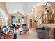 Spacious living room with vaulted ceilings, large windows, and cozy seating areas at 8040 W 78Th Cir, Arvada, CO 80005