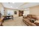 Spacious living area featuring plush carpeting, a comfortable couch, and an abundance of natural light at 8040 W 78Th Cir, Arvada, CO 80005
