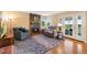 Inviting living room with a fireplace, hardwood floors, and access to the outdoors at 8040 W 78Th Cir, Arvada, CO 80005