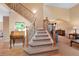 Classic staircase with wood and wrought iron detailing, leading to the upper level and living areas at 8040 W 78Th Cir, Arvada, CO 80005