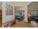 Inviting entryway showcasing hardwood floors, artwork, and seamless flow to the living spaces at 6637 Berry Bush Ln, Evergreen, CO 80439