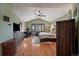 Bright bedroom with hardwood floors, a vaulted ceiling, and a window with natural light at 6637 Berry Bush Ln, Evergreen, CO 80439