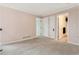Empty bedroom featuring neutral walls and adjoining bathroom at 20886 Parliament Pl, Parker, CO 80138