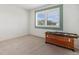 Bright bedroom with large windows and a wooden chest at 20886 Parliament Pl, Parker, CO 80138