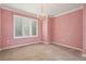 Pink dining room featuring a chandelier and window at 20886 Parliament Pl, Parker, CO 80138