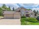 Beautiful two-story home featuring a three car garage and well-maintained landscaping at 20886 Parliament Pl, Parker, CO 80138