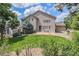 Spacious backyard with a well-manicured lawn, a patio, and mature trees surrounding the property at 20886 Parliament Pl, Parker, CO 80138