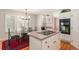 Well-lit kitchen with stainless appliances, a glass top island, and a dining area at 20886 Parliament Pl, Parker, CO 80138