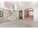 Open-concept living room featuring a staircase, high ceilings, and neutral decor at 20886 Parliament Pl, Parker, CO 80138