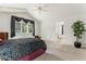Spacious main bedroom featuring bright windows and a ceiling fan at 20886 Parliament Pl, Parker, CO 80138