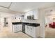 Finished basement featuring a wet bar, and pendant lighting at 20886 Parliament Pl, Parker, CO 80138