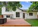 Rear exterior featuring a wooden deck perfect for outdoor relaxation with a grass backyard at 1102 Conifer Ct, Highlands Ranch, CO 80126