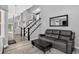 Open concept living area with modern decor and stairway at 1102 Conifer Ct, Highlands Ranch, CO 80126