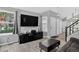 Comfortable living room with a large TV and neutral walls at 1102 Conifer Ct, Highlands Ranch, CO 80126